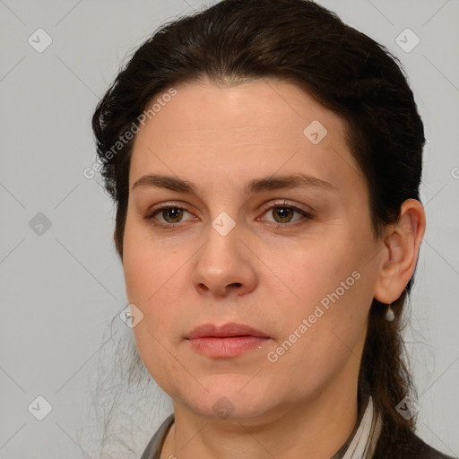 Joyful white young-adult female with medium  brown hair and grey eyes