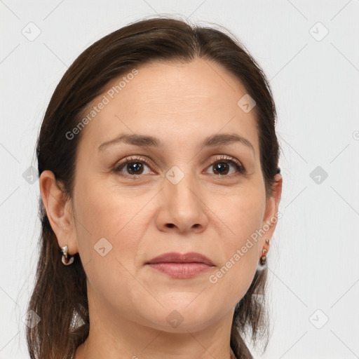 Joyful white adult female with medium  brown hair and brown eyes