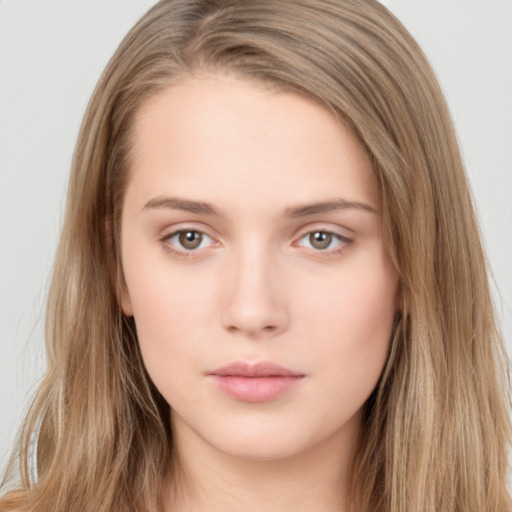 Neutral white young-adult female with long  brown hair and brown eyes