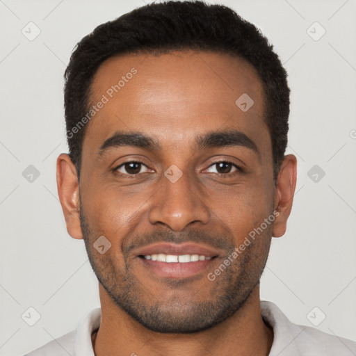 Joyful black young-adult male with short  black hair and brown eyes