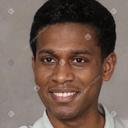 Joyful black young-adult male with short  black hair and brown eyes