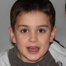 Joyful white child male with short  brown hair and brown eyes