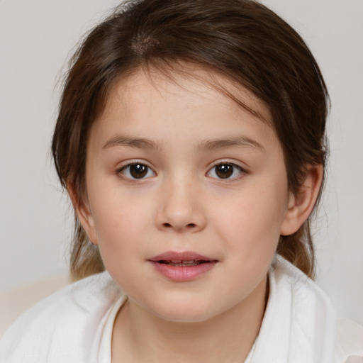 Joyful white child female with medium  brown hair and brown eyes