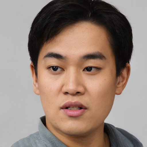 Neutral asian young-adult male with short  black hair and brown eyes