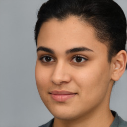 Joyful latino young-adult female with short  brown hair and brown eyes