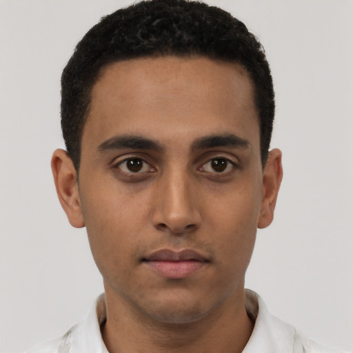 Neutral latino young-adult male with short  brown hair and brown eyes