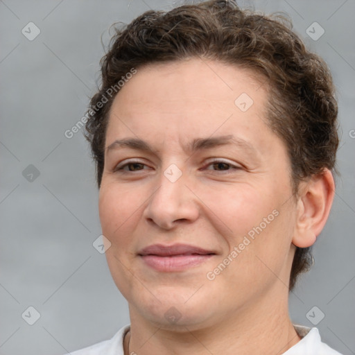 Joyful white adult female with short  brown hair and brown eyes