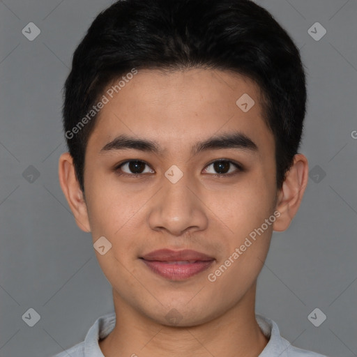 Joyful asian young-adult male with short  brown hair and brown eyes