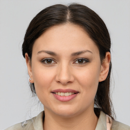 Joyful white young-adult female with medium  brown hair and brown eyes