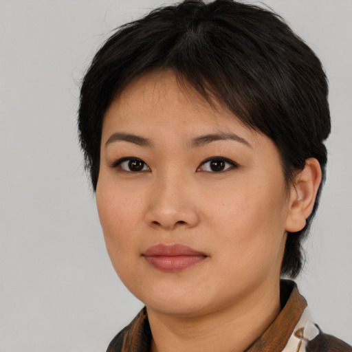 Neutral asian young-adult female with medium  brown hair and brown eyes