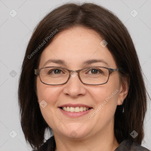 Joyful white adult female with medium  brown hair and brown eyes