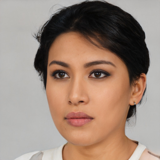 Neutral asian young-adult female with medium  brown hair and brown eyes