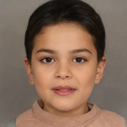 Joyful white child female with short  brown hair and brown eyes