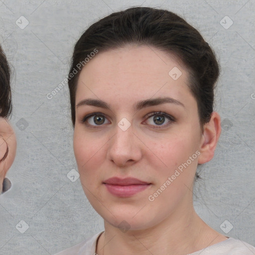 Neutral white young-adult female with short  brown hair and brown eyes