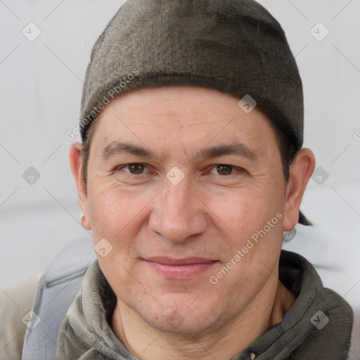 Joyful white adult male with short  brown hair and grey eyes