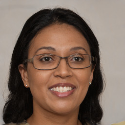 Joyful asian adult female with medium  brown hair and brown eyes