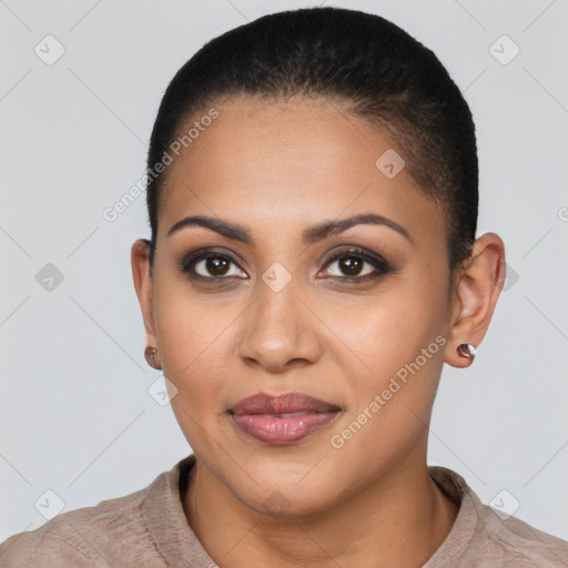 Joyful latino young-adult female with short  brown hair and brown eyes