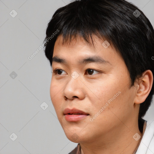 Neutral asian young-adult male with short  black hair and brown eyes