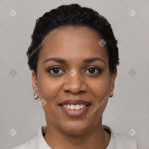 Joyful black young-adult female with short  black hair and brown eyes