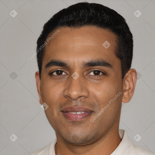 Joyful latino young-adult male with short  black hair and brown eyes