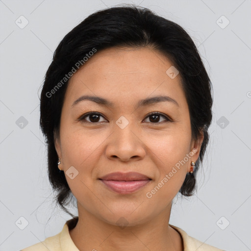 Joyful latino young-adult female with medium  brown hair and brown eyes