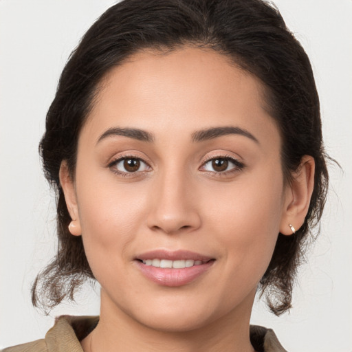 Joyful white young-adult female with medium  brown hair and brown eyes