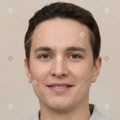 Joyful white young-adult male with short  brown hair and brown eyes