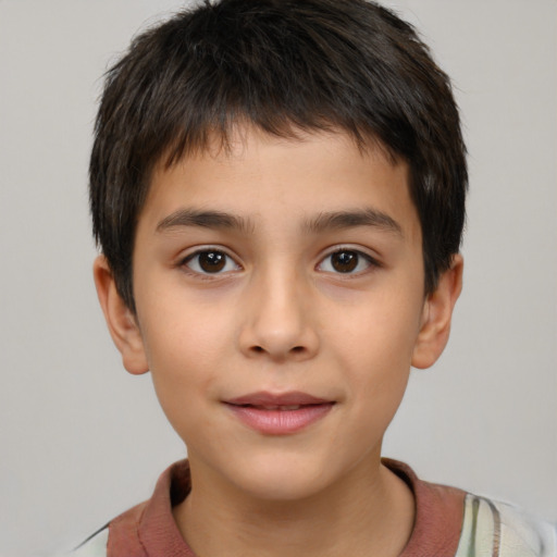 Joyful white child male with short  brown hair and brown eyes