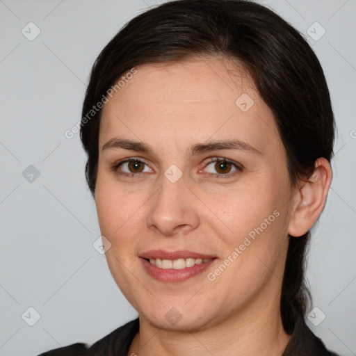 Joyful white adult female with medium  brown hair and brown eyes