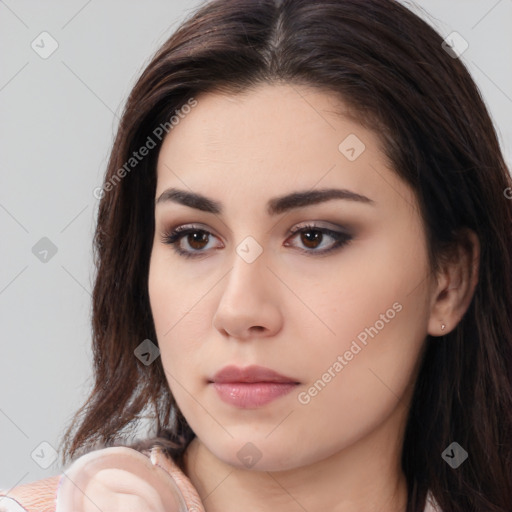 Neutral white young-adult female with long  brown hair and brown eyes