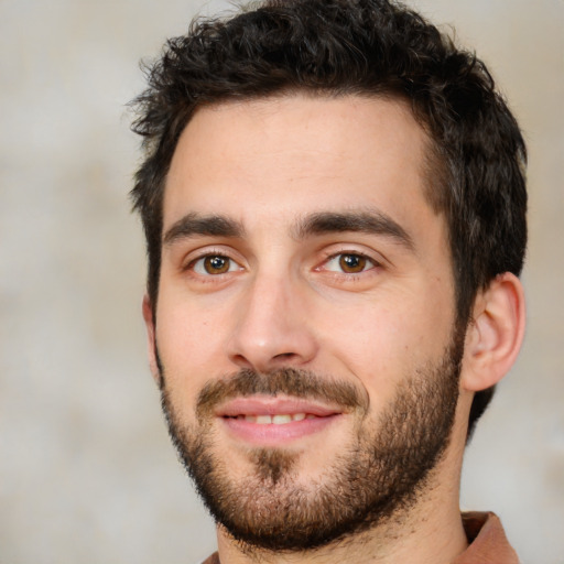 Joyful white young-adult male with short  black hair and brown eyes