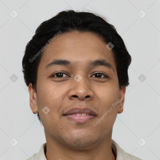 Joyful latino young-adult male with short  brown hair and brown eyes