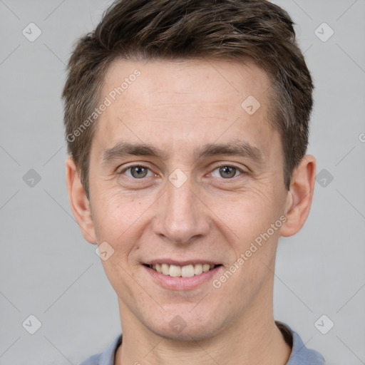 Joyful white adult male with short  brown hair and brown eyes