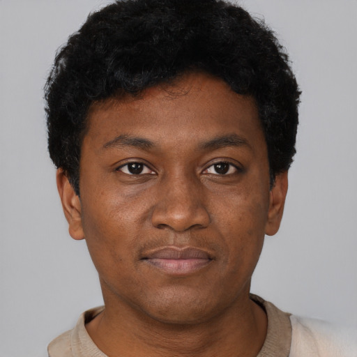 Neutral black young-adult male with short  black hair and brown eyes
