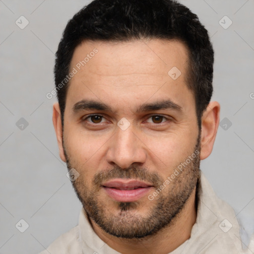 Joyful white young-adult male with short  black hair and brown eyes