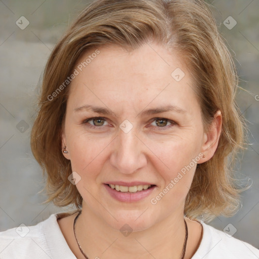 Joyful white adult female with medium  brown hair and blue eyes