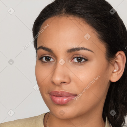 Joyful latino young-adult female with long  brown hair and brown eyes