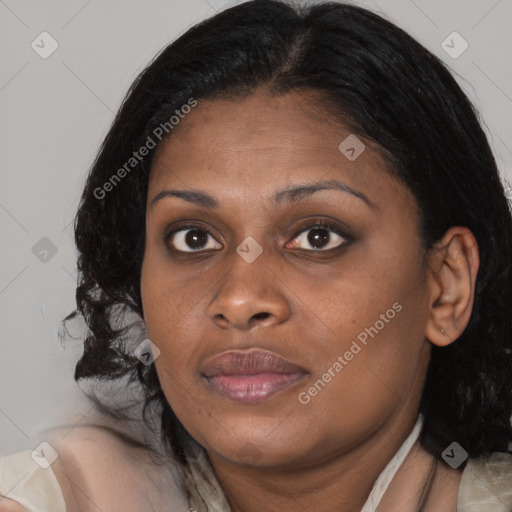 Joyful black young-adult female with medium  brown hair and brown eyes