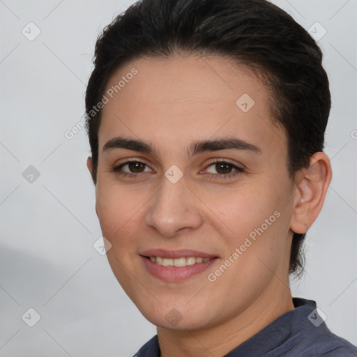 Joyful white young-adult female with short  brown hair and brown eyes