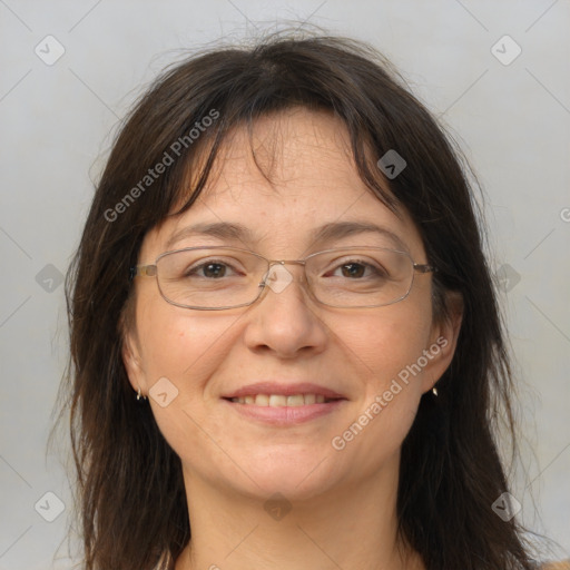 Joyful white adult female with medium  brown hair and brown eyes