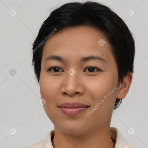 Joyful asian young-adult female with short  brown hair and brown eyes