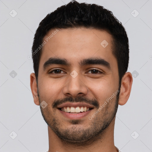 Joyful latino young-adult male with short  black hair and brown eyes