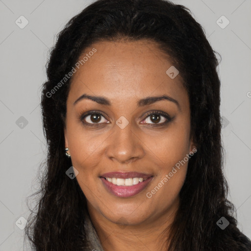 Joyful black young-adult female with long  brown hair and brown eyes