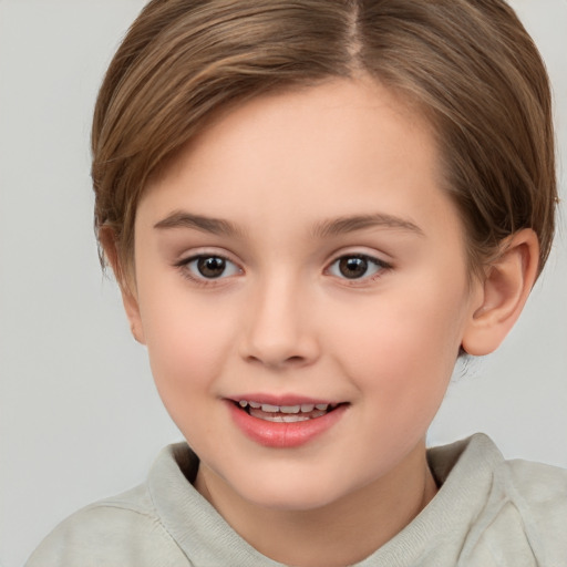 Joyful white child female with short  brown hair and brown eyes