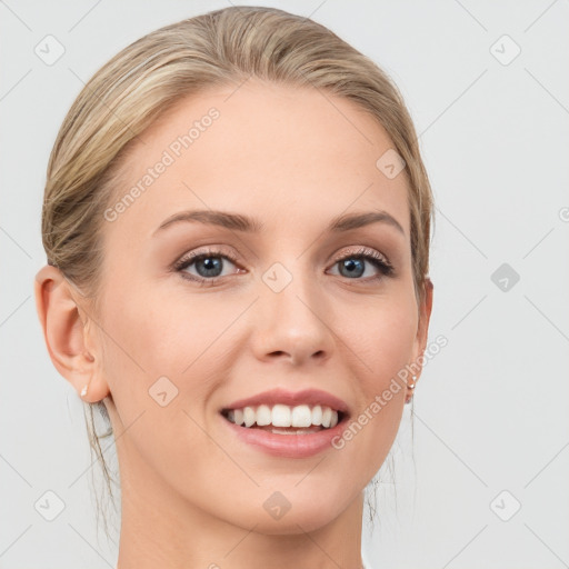 Joyful white young-adult female with medium  brown hair and blue eyes