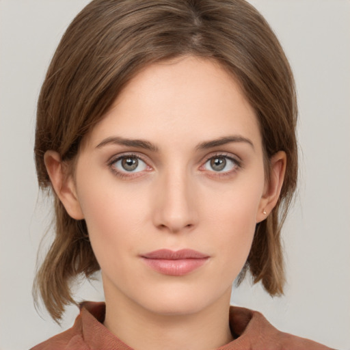 Neutral white young-adult female with medium  brown hair and grey eyes