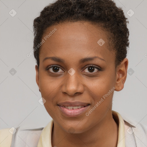 Joyful black young-adult female with short  brown hair and brown eyes