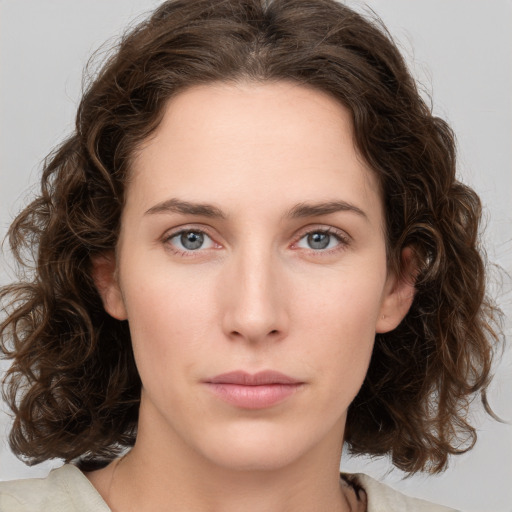 Neutral white young-adult female with medium  brown hair and green eyes