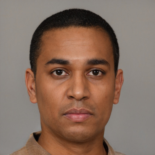 Neutral latino young-adult male with short  black hair and brown eyes