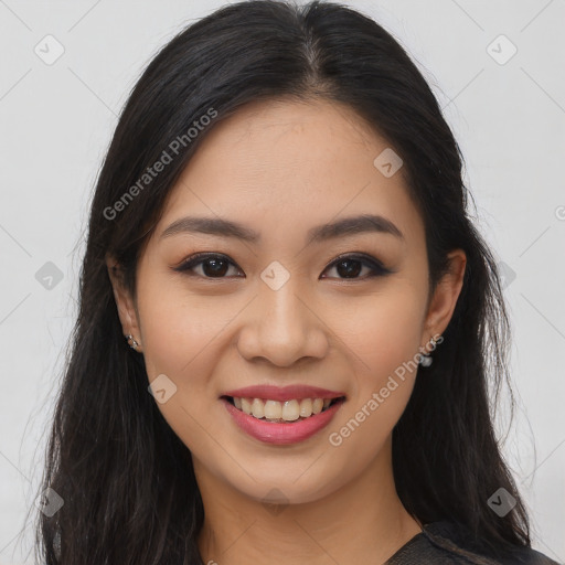 Joyful asian young-adult female with long  brown hair and brown eyes